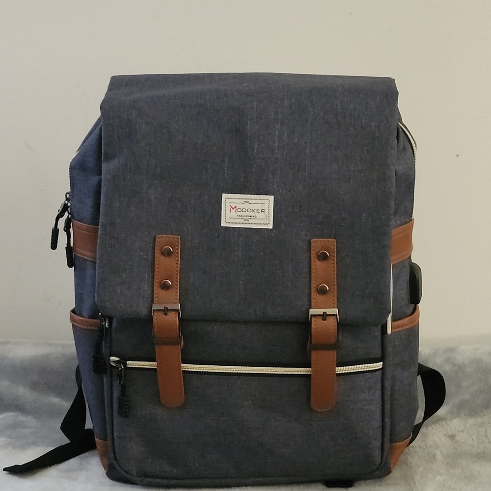 Modoker Vintage  Laptop Backpack with an external USB charging port Color: Gray
